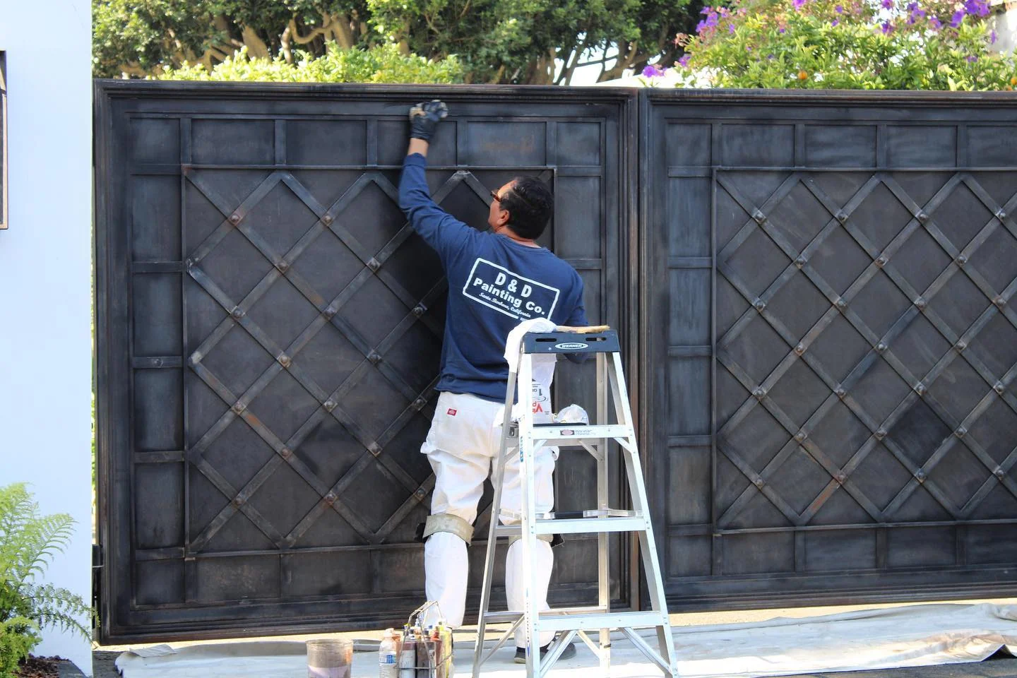 D&D Painting craftsman finishing a detailed gate